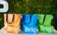 Orange, blaue und grüne Shopper und Kulturbeutel aus gebrauchten NXP-Messebannern